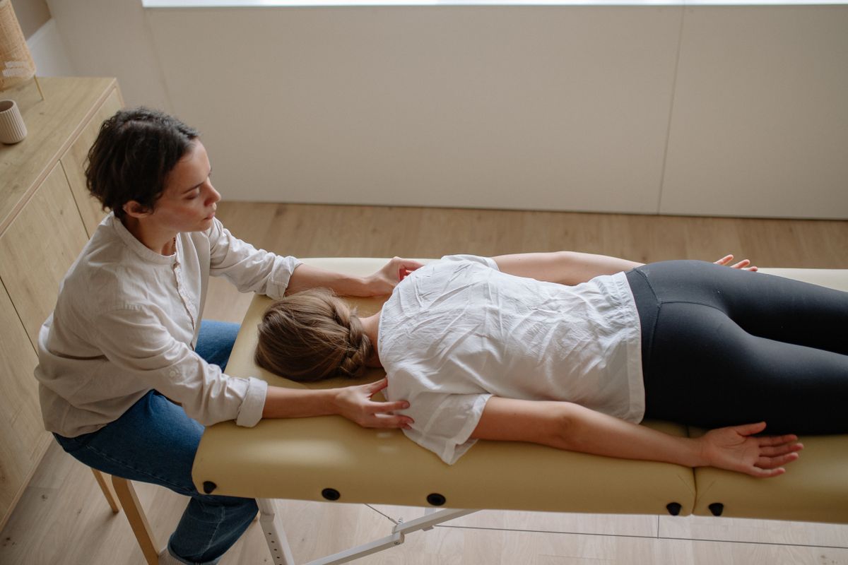Chiropractor performing a spinal adjustment on a patient at Iron Spine Medical in Lakeland, Florida