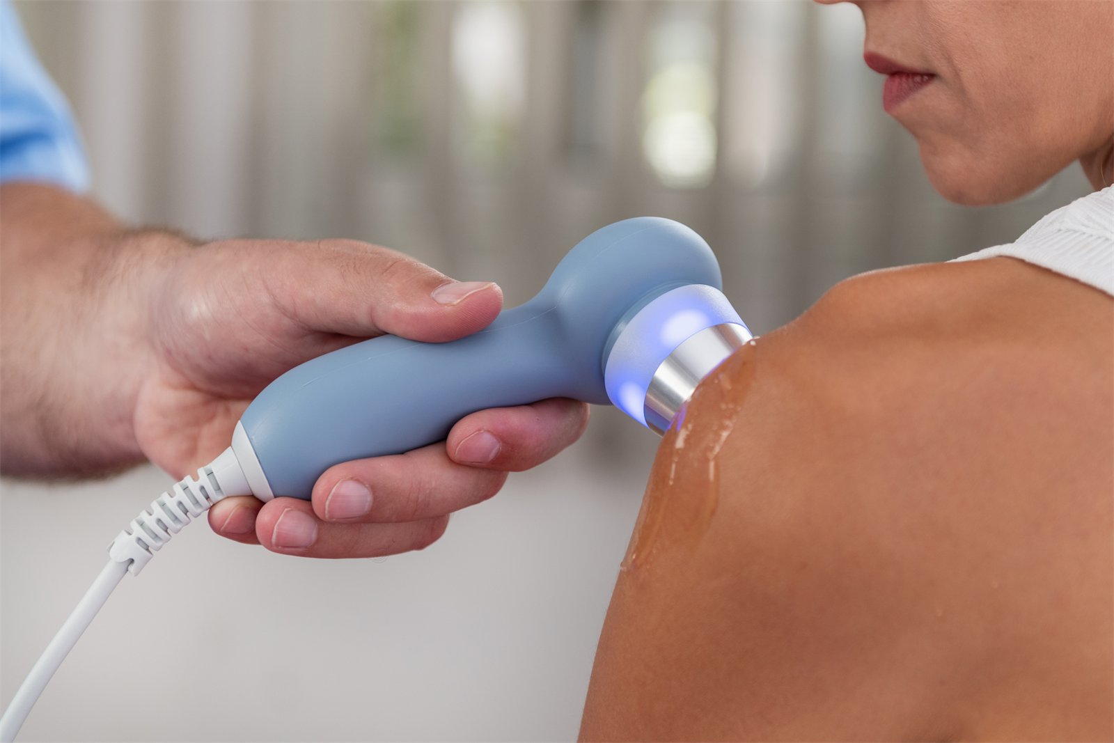 SoftWave Therapy applicator treating a shoulder